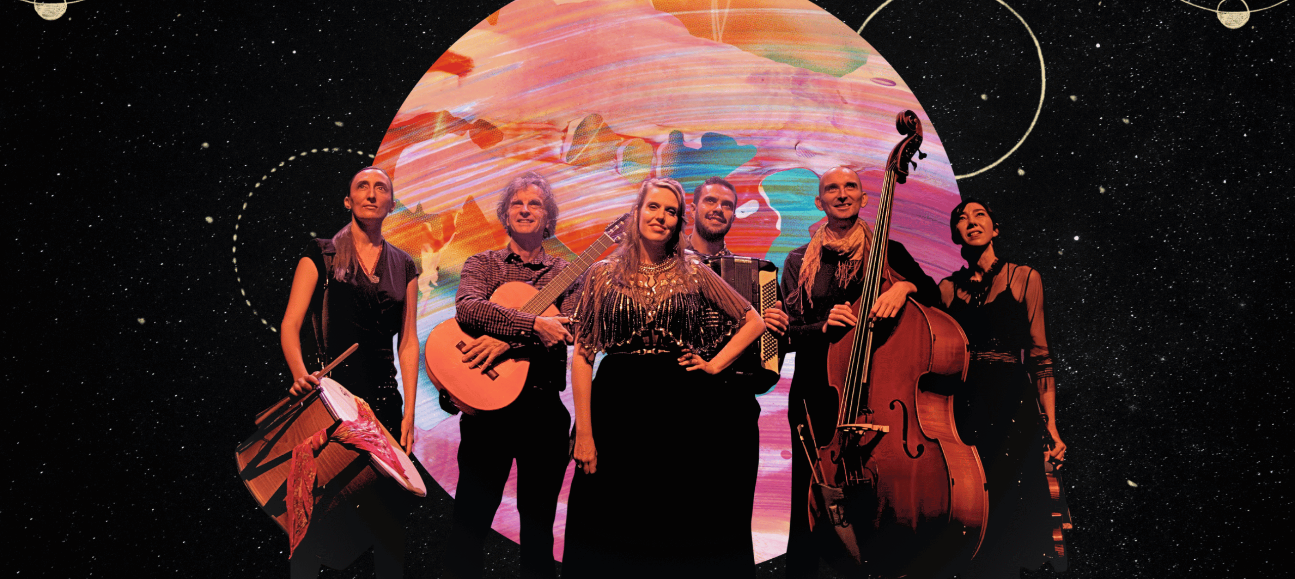 Group of musicians, holding their instruments in front of a large projection of a planet