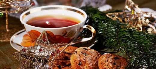 table spread of high tea with christmas decor on table